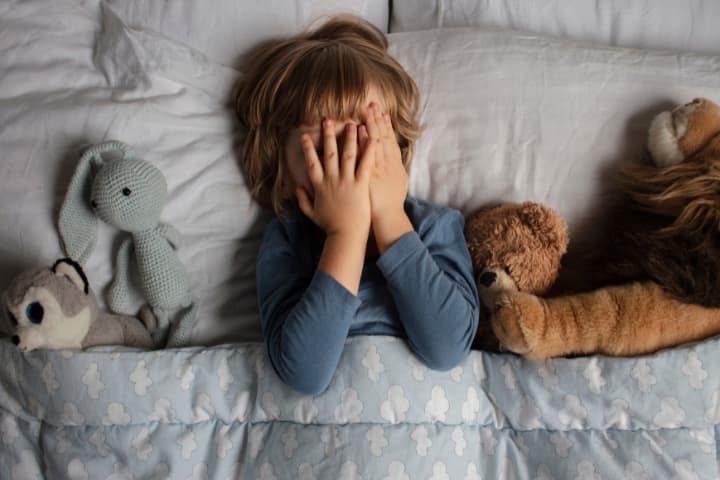Young boy scared by nightmares