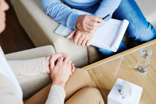 Two people sitting and talking